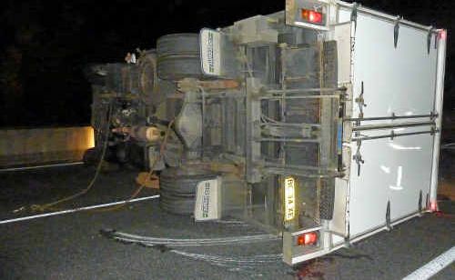 A truck driver is lucky to be alive after his truck overturned after colliding with the median strip at Chinderah. A truck driver is lucky to be alive after his truck overturned after colliding with the median strip at Chinderah.